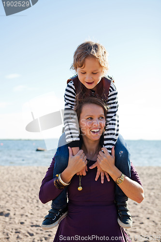 Image of Mother and son at beach.