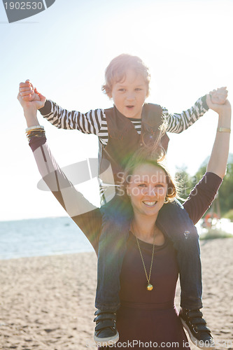 Image of Mother and son at beach.