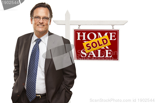 Image of Businessman and Sold Home For Sale Real Estate Sign Isolated