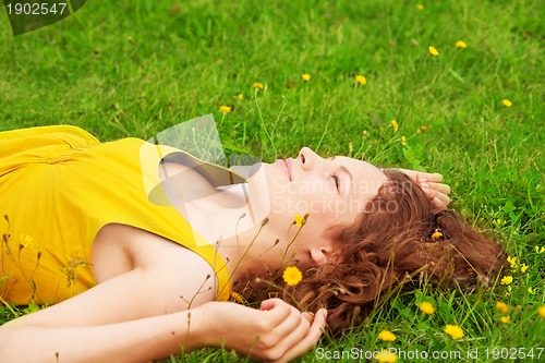 Image of girl relaxing on the grass