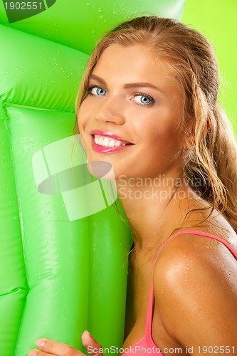 Image of girl in bikini with matress