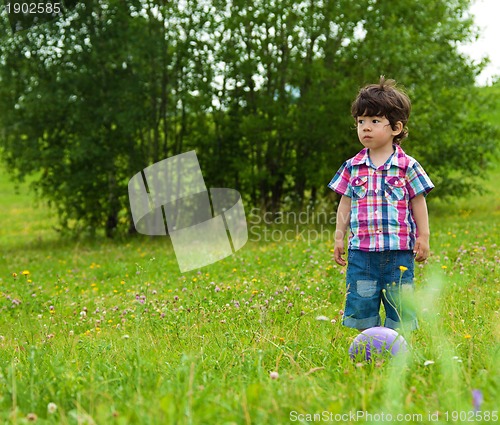 Image of sad boy waiting friend to play