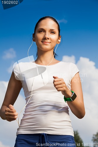 Image of confident runner with headphones