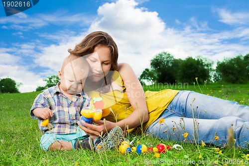 Image of mother playing with son in park