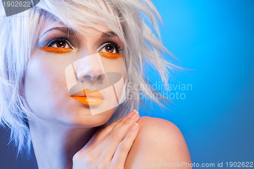 Image of sexy blond woman portrait on blue