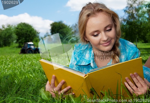 Image of country girl reading a book