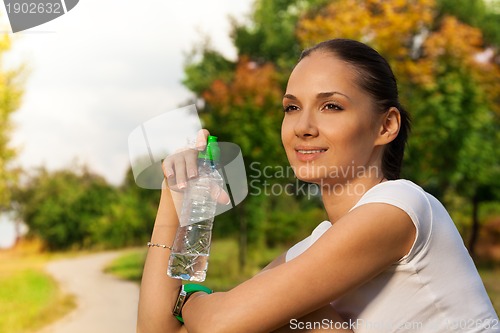 Image of happy girl sitting and resting