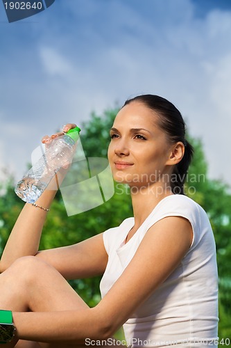 Image of confident girl resting after jogging