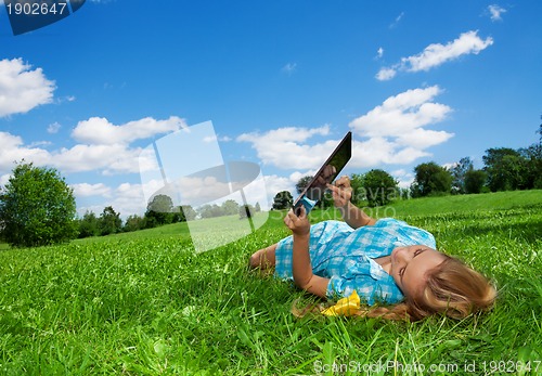 Image of student enjoying internet  in park