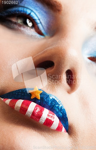 Image of girl with american flag on lips