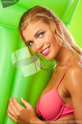 Image of attractive girl in bikini smiling