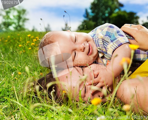 Image of mom and her baby on the grass
