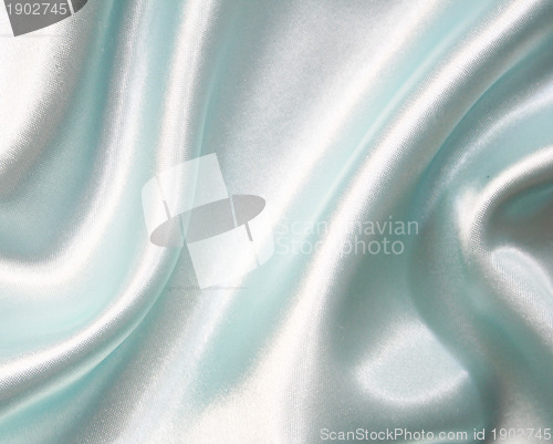 Image of Smooth elegant blue silk as background 