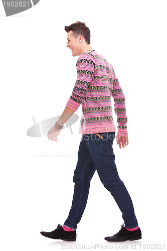 Image of side view of a fashion man walking