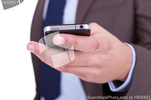 Image of Flat cell phone in businessman hand