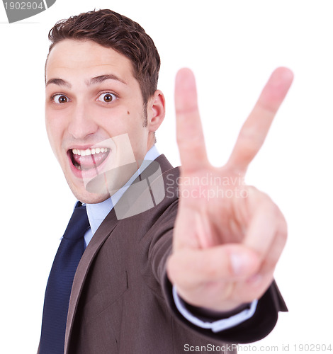 Image of businessman making the victory hand gesture