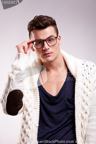 Image of stylish young man wearing glasses