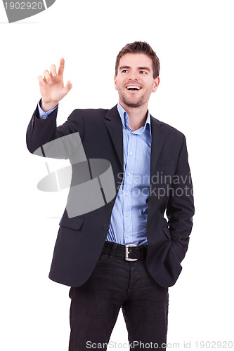 Image of business man pushing imaginary buttons 