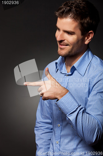 Image of man presenting or pointing