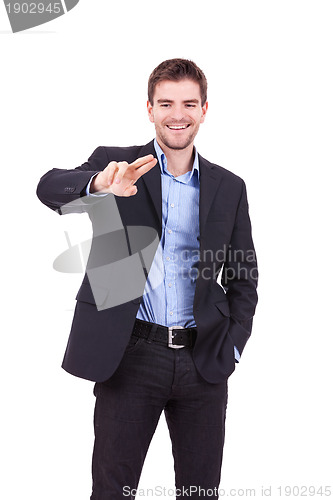 Image of business man touching imaginary screen