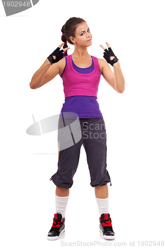 Image of sporty woman gesturing a  win symbol 
