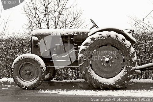 Image of old tractor in winter