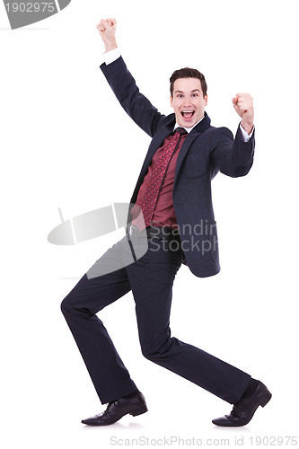Image of  happy successful gesturing business man