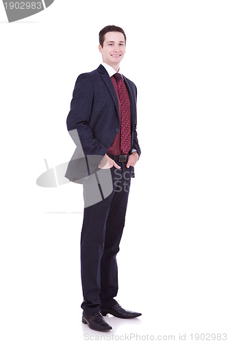 Image of  business man standing with hands in pocket