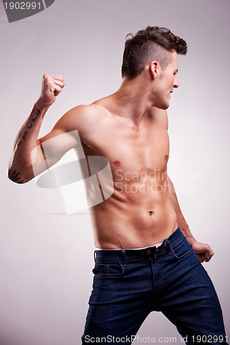 Image of young flexed muscular dancer