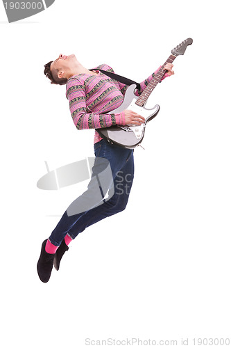 Image of passionate guitarist jumps in the air