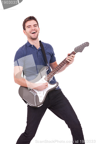 Image of smiling man playing an electric guitar