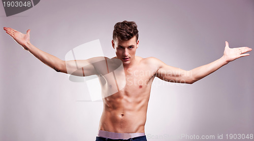 Image of  model with his hands in the air 