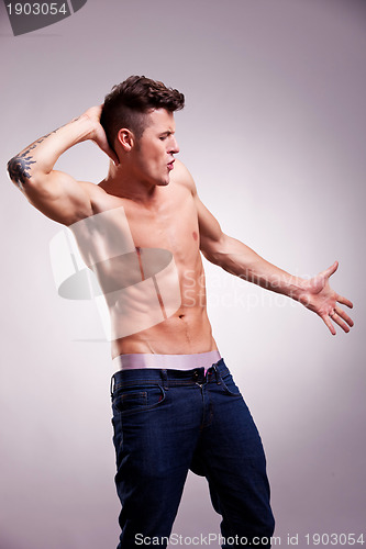 Image of muscular young dancer posing