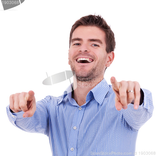 Image of  handsome young man pointing
