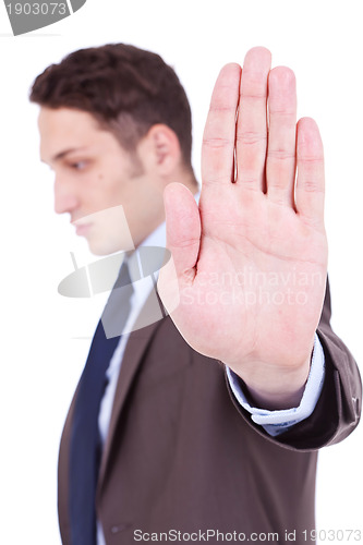 Image of Business man showing stop gesture 