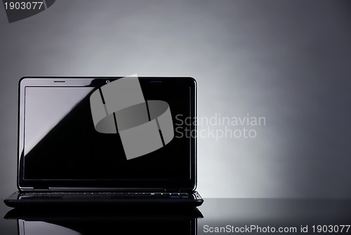 Image of Laptop shot on reflective table