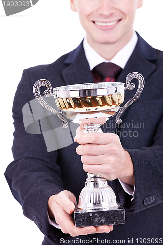 Image of man handing a trophy ove