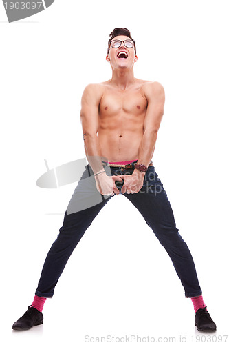 Image of excited shirtless man screaming and looking up