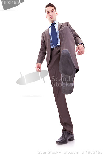 Image of business man stepping on something