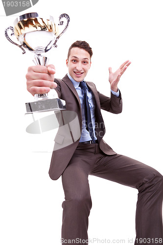 Image of excited young business man winning a nice trophy