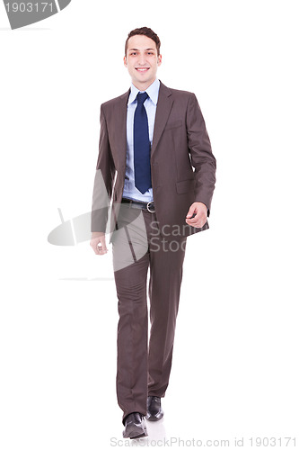 Image of young business man is walking towards the camera