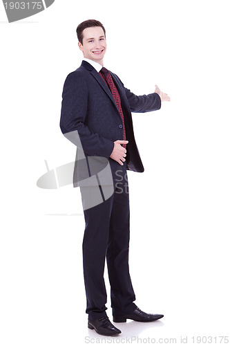 Image of man in black suit making presentation 