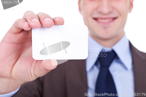 Image of business man holding a blank card 