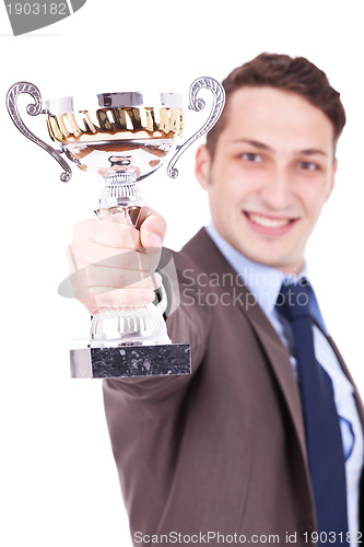 Image of business man handing a trophy 