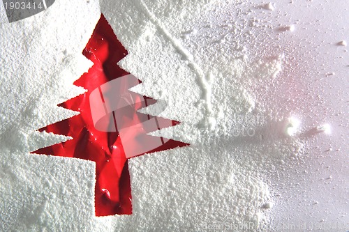 Image of christmas tree from the paper and snow