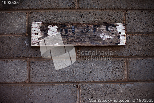 Image of Worn bathroom sign