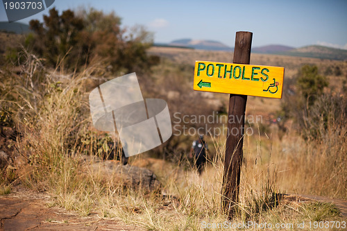 Image of Potholes sign