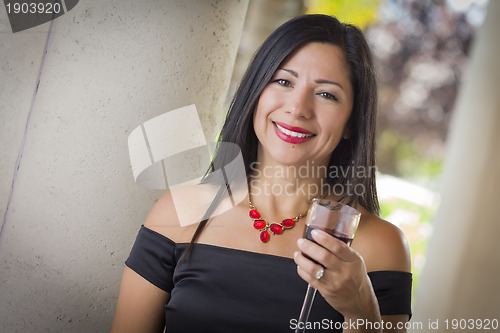 Image of Attractive Hispanic Woman Portrait Outside Enjoying Wine