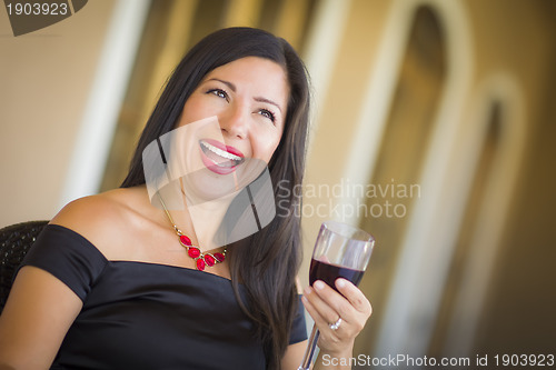 Image of Attractive Hispanic Woman Portrait Outside Enjoying Wine