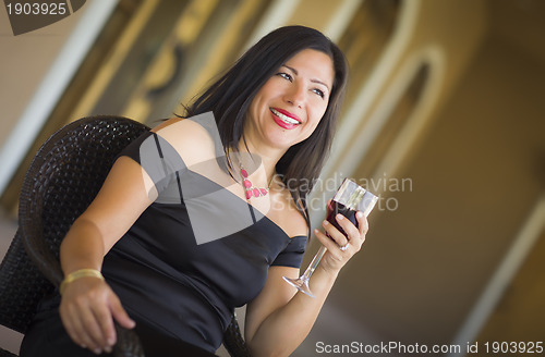 Image of Attractive Hispanic Woman Portrait Outside Enjoying Wine